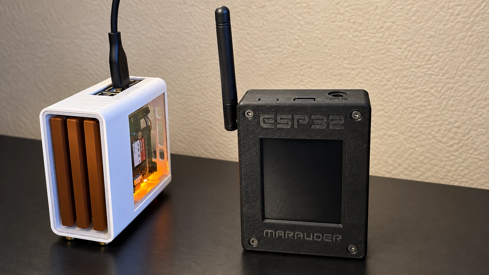 ESP32 Marauder v6.1 beside a white-cased Raspberry Pi on Trevor Unland's workbench